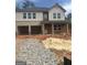 Two-story home with attached two-car garage and a charming brick-columned porch at 742 Great Oak Pl # 13, Villa Rica, GA 30180