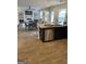 Open-concept living and dining area with hardwood floors, a fireplace, and lots of natural light at 742 Great Oak Pl # 13, Villa Rica, GA 30180