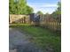 View of a backyard with a wooden fence and animal feeder at 1225 Pitts Chapel E, Newborn, GA 30056