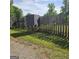 View of a backyard with a wooden fence and animal feeder at 1225 Pitts Chapel E, Newborn, GA 30056