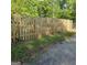 View of a backyard with a wooden fence and grass at 1225 Pitts Chapel E, Newborn, GA 30056