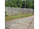 View of a backyard with a wooden fence and grass at 1225 Pitts Chapel E, Newborn, GA 30056