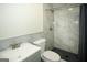 Modern bathroom with a gray vanity and a tiled walk-in shower at 1225 Pitts Chapel E, Newborn, GA 30056