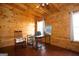 Cozy bedroom with wood-paneled walls, hardwood floors, and natural light at 1225 Pitts Chapel E, Newborn, GA 30056