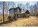Beautiful log home with a cozy covered porch and well-maintained yard at 1225 Pitts Chapel E, Newborn, GA 30056