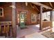 Inviting front porch with wood columns and a green front door at 1225 Pitts Chapel E, Newborn, GA 30056