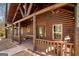 Charming log cabin porch featuring rustic wood railings and a cozy seating area at 1225 Pitts Chapel E, Newborn, GA 30056