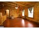 Bright and airy living room with wood flooring, ceiling fan, and large windows at 1225 Pitts Chapel E, Newborn, GA 30056