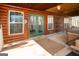 Log cabin patio with hot tub and outdoor seating area at 1225 Pitts Chapel E, Newborn, GA 30056