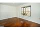 Bright room with hardwood floors and a large window overlooking the yard at 1225 Pitts Chapel E, Newborn, GA 30056