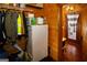 Efficient storage room featuring shelves, a mini-fridge, and door leading to outdoor space at 1225 Pitts Chapel E, Newborn, GA 30056