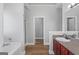 Bathroom featuring a tub, shower, and vanity with dark wood cabinets at 835 Betsy Ross Trail, Hampton, GA 30228