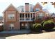 Exterior view of a two-story home with a deck, patio, and well-maintained backyard at 2920 Stanway Ave, Douglasville, GA 30135