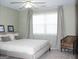 Well-lit main bedroom with large windows and a relaxing sitting area at 2920 Stanway Ave, Douglasville, GA 30135