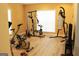 Bright gym featuring exercise equipment, wood flooring, and a large window at 2920 Stanway Ave, Douglasville, GA 30135