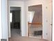 Upstairs hallway with a view to a bedroom and stairwell at 2920 Stanway Ave, Douglasville, GA 30135