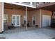 Outdoor patio area under deck offering seating area with access to garage and backyard at 2920 Stanway Ave, Douglasville, GA 30135