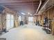 Unfinished basement with wooden studs and visible ceiling joists, ready for customization and expansion at 6302 Manassas Nw Pass, Acworth, GA 30101