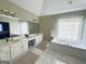 Bright bathroom featuring a double sink vanity, tiled floors, and a soaking tub at 6302 Manassas Nw Pass, Acworth, GA 30101