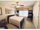 Bedroom with a ceiling fan, bed, and window with blinds and decor at 6302 Manassas Nw Pass, Acworth, GA 30101