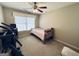 Bedroom featuring a ceiling fan, a small bed, and exercise equipment at 6302 Manassas Nw Pass, Acworth, GA 30101