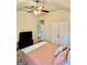 Bedroom featuring a queen bed, ceiling fan, and a view into a doorway at 9444 Lantana Trl, Jonesboro, GA 30238