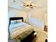 Bright bedroom with queen bed, ceiling fan, and neutral decor at 9444 Lantana Trail, Jonesboro, GA 30238