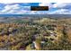 An aerial view of 460 Carrie Kathleen Terrace in Carrollton, GA, surrounded by trees and other homes at 460 Carrie Kathleen Ter, Carrollton, GA 30116