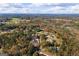 This aerial view shows homes in a rural neighborhood with tree coverage at 460 Carrie Kathleen Ter, Carrollton, GA 30116