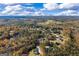 Expansive aerial view of the properties surrounded by colorful fall foliage and a picturesque landscape at 460 Carrie Kathleen Ter, Carrollton, GA 30116