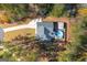 A captivating aerial view of a home with a pool, surrounded by lush trees and a well-maintained yard at 460 Carrie Kathleen Ter, Carrollton, GA 30116