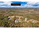 This aerial view shows homes in a rural neighborhood with trees at 460 Carrie Kathleen Ter, Carrollton, GA 30116