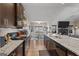 A view of the kitchen, showcasing the island and open floor plan to the dining and living room at 460 Carrie Kathleen Ter, Carrollton, GA 30116