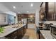 This spacious kitchen includes a large island, modern appliances and wood-look flooring at 460 Carrie Kathleen Ter, Carrollton, GA 30116