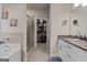 This bright main bathroom includes double sinks, a tiled shower and a walk in closet at 460 Carrie Kathleen Ter, Carrollton, GA 30116