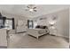 This spacious main bedroom includes a tray ceiling, ceiling fan, and sitting area at 460 Carrie Kathleen Ter, Carrollton, GA 30116