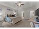 Bright main bedroom featuring tray ceilings, ceiling fan and neutral decor at 460 Carrie Kathleen Ter, Carrollton, GA 30116