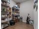 A large pantry provides ample storage space with metal racks and hardwood floors at 460 Carrie Kathleen Ter, Carrollton, GA 30116