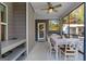 A screened porch provides space for dining and relaxing in the backyard at 460 Carrie Kathleen Ter, Carrollton, GA 30116