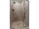 Neutral-toned tiled shower enclosure features glass door and overhead shower fixture at 460 Carrie Kathleen Ter, Carrollton, GA 30116