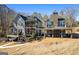 Backyard living space with a stone fireplace and outdoor seating at 50 Birch Rd, Covington, GA 30014