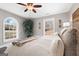 Main bedroom featuring lots of light, a ceiling fan, and natural wall decor at 50 Birch Rd, Covington, GA 30014