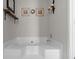 Close-up of the bathroom soaking tub with step up, faucet, and decorative shelving at 70 Willow Bend Nw Dr, Cartersville, GA 30121