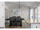 Cozy dining area with modern lighting, adjacent to a bright kitchen and patio access at 70 Willow Bend Nw Dr, Cartersville, GA 30121