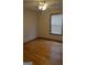 Bedroom with natural light, ceiling fan, and hardwood floors at 5475 Pepperwood Ct, Stone Mountain, GA 30087