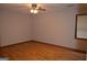 Bedroom with ceiling fan, natural light, and hardwood floors at 5475 Pepperwood Ct, Stone Mountain, GA 30087