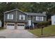 Charming home featuring a two-car garage and well-maintained front yard at 5475 Pepperwood Ct, Stone Mountain, GA 30087