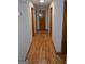 Hallway features hardwood flooring and neutral colored walls at 5475 Pepperwood Ct, Stone Mountain, GA 30087