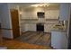 Modern kitchen featuring white cabinets, stainless steel appliances, and a subway tile backsplash at 5475 Pepperwood Ct, Stone Mountain, GA 30087