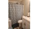Bathroom featuring a vanity with marble countertop and a shower/tub with decorative curtain at 945 Bethany Rd, Covington, GA 30016
